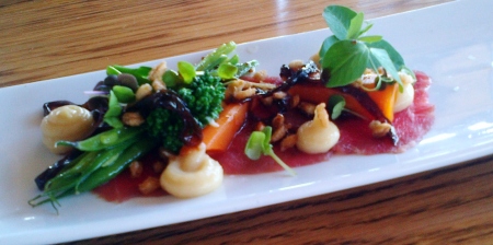 Beef carpaccio with balsamic onion, pickled vegetables and puffed barley